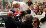 Pope kisses, blesses 