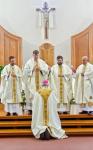 Bishop ordains four to the priesthood